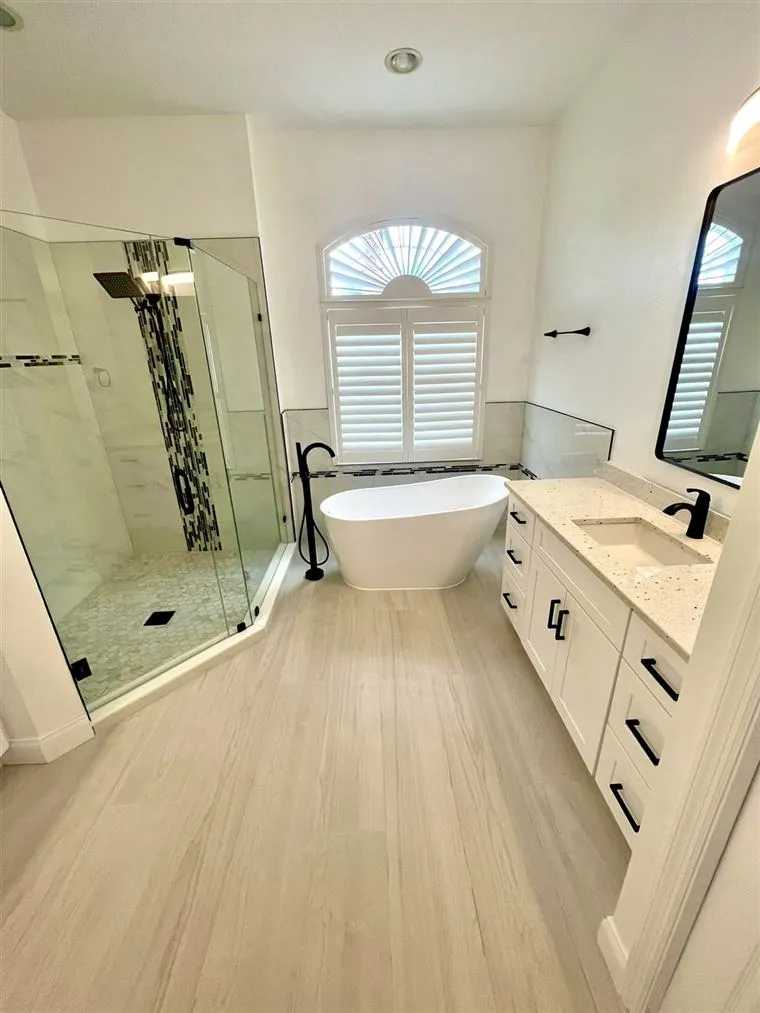 Renovated bathroom with walk-in shower and soaking tub in Tampa Bay, FL