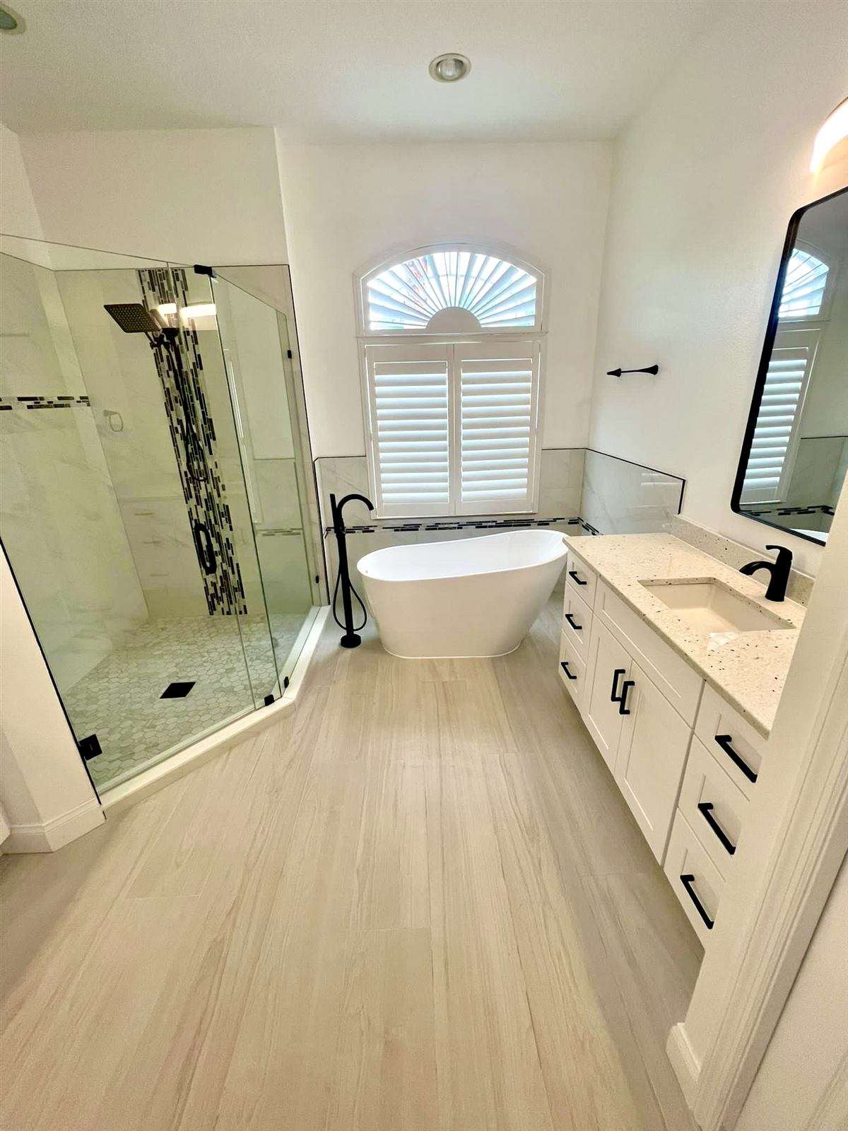 Renovated bathroom with walk-in shower and soaking tub in Tampa Bay, FL